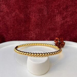 Bracelete linha esferica dourado